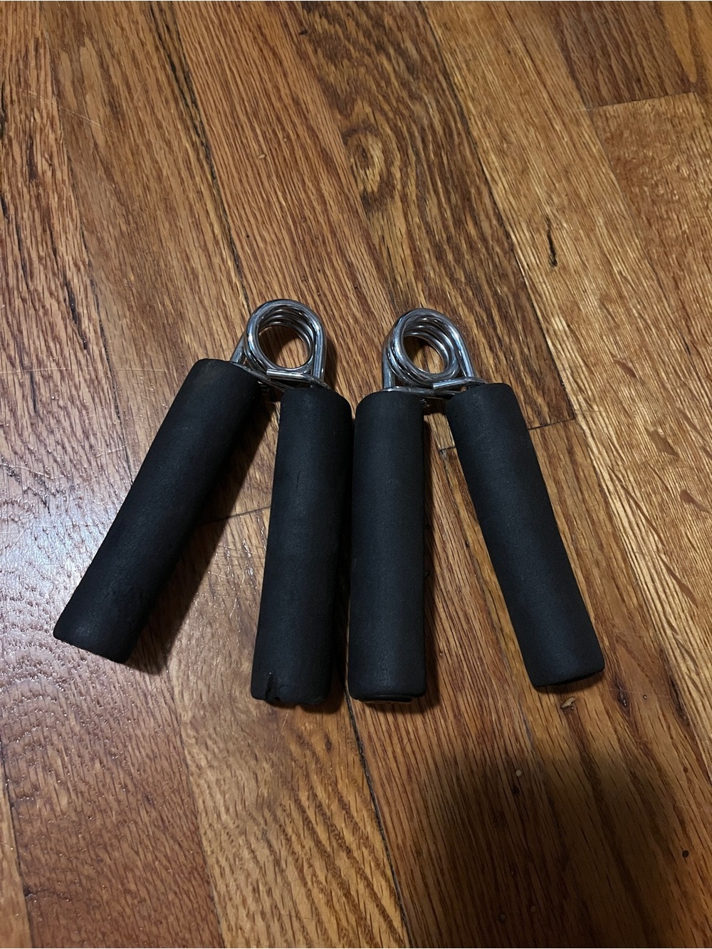 Pair of Black Foam Hand Grips - Resistance Spring Grip Trainers